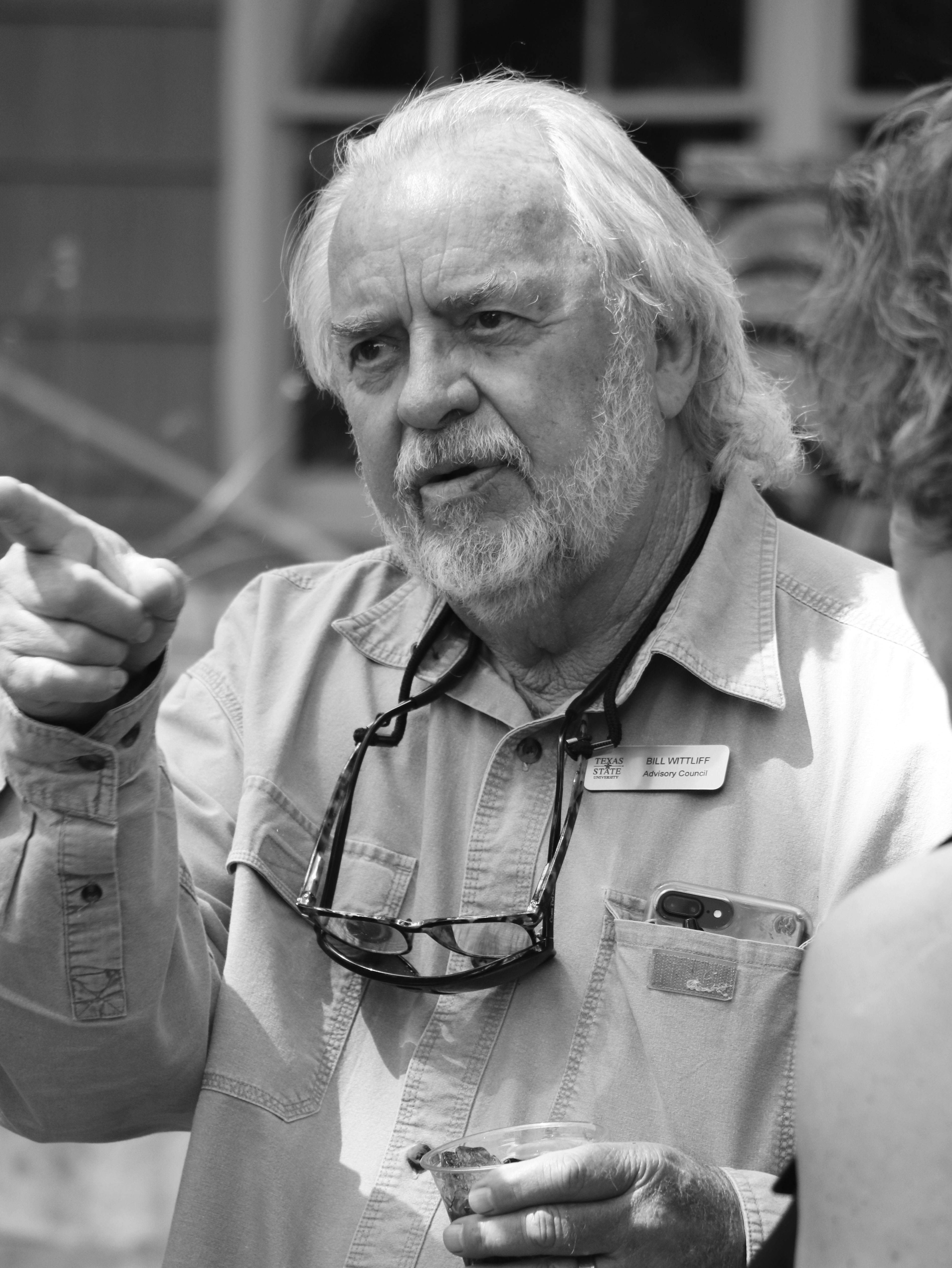 Bill Wittliff pointing and directing a film on set
